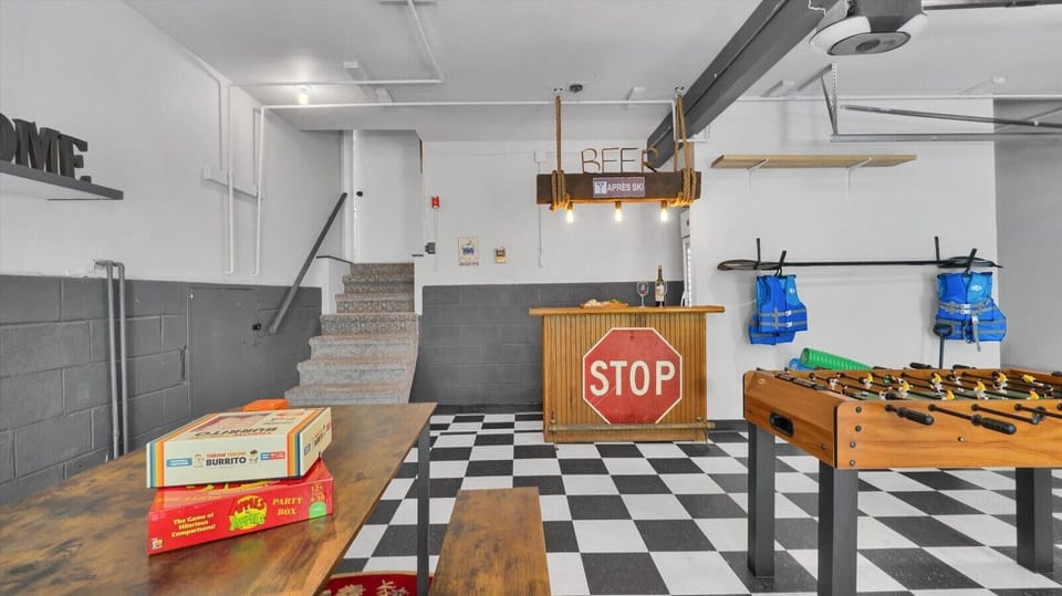 Dedicated game table with chairs and board games for all ages to enjoy.