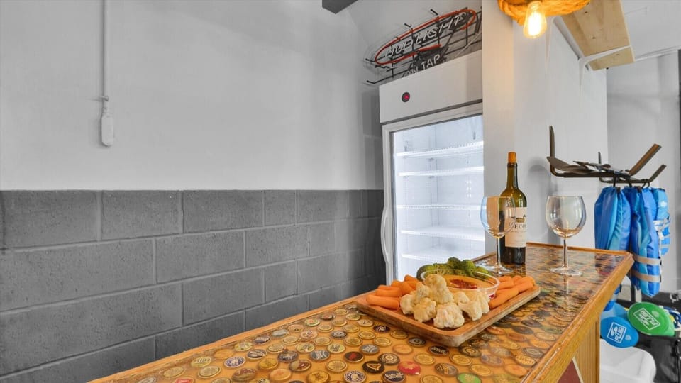 Bar area with a fridge for your drinks, perfect for enjoying the game room.