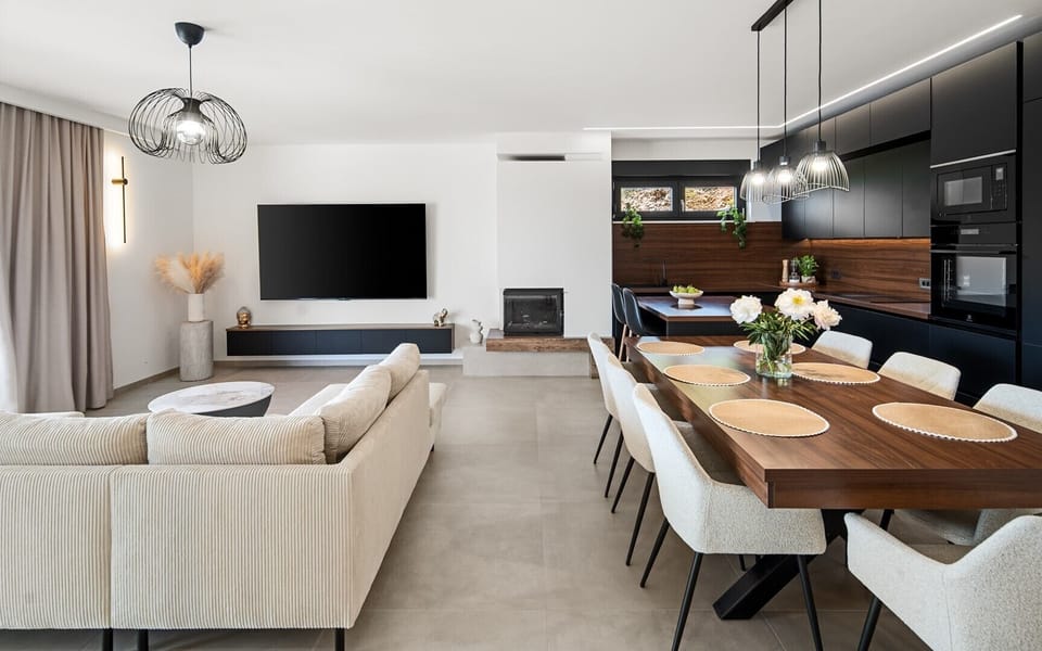 The ground floor encompasses a spacious 54 sqm living and dining area designed for comfort and style