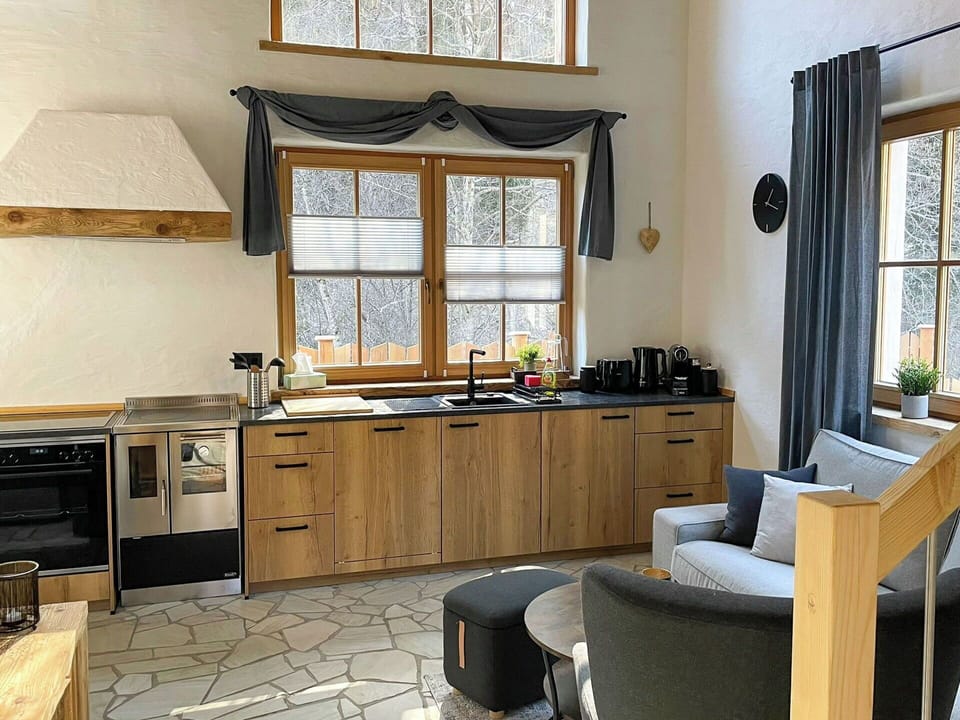 Furniture, Interior Design, Kitchen, Flooring, Wood, Countertop, Cabinetry, Floor, Chair, Kitchen Appliance