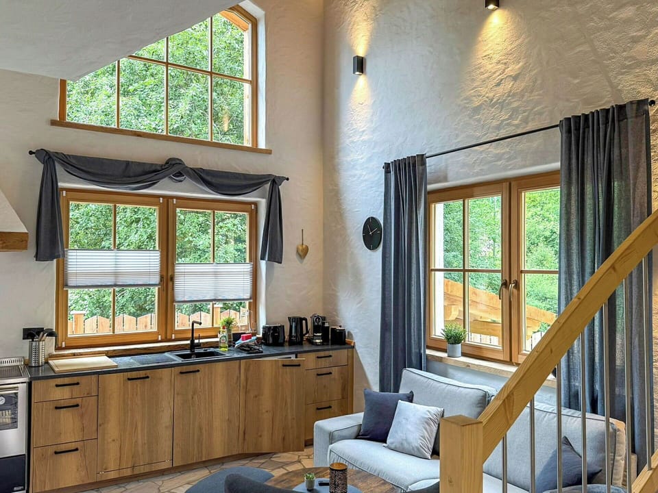 Furniture, Interior Design, Flooring, Wood, Floor, Home, Room, Lighting, Ceiling, Chair