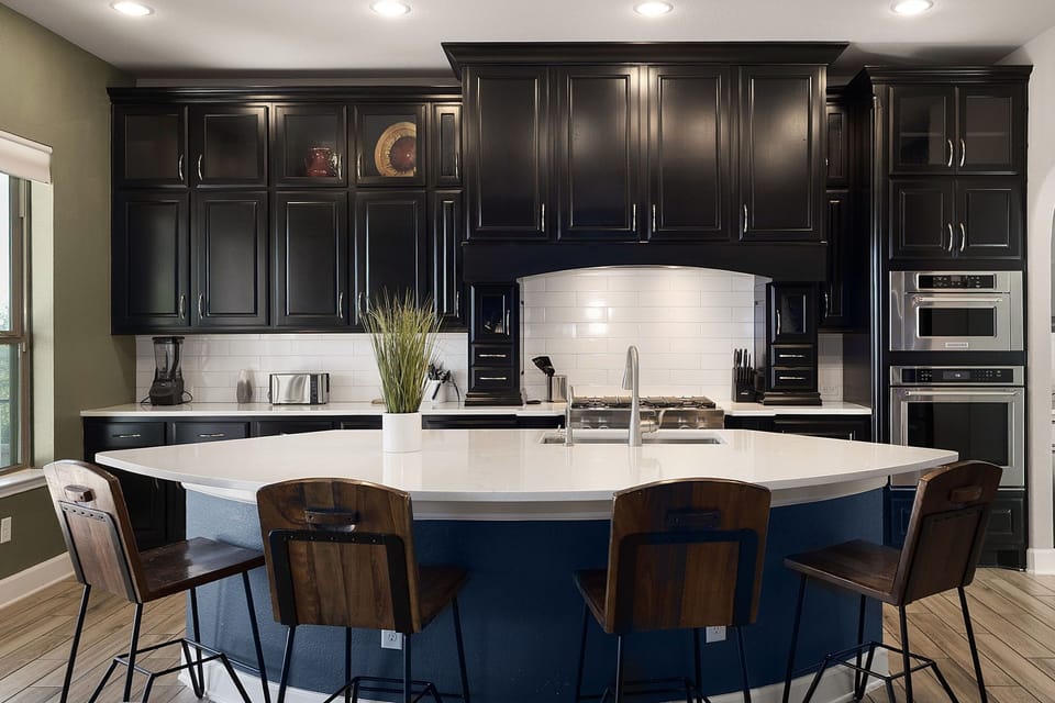 Large kitchen island with bar seating—ideal for meals, drinks, and group conversations 