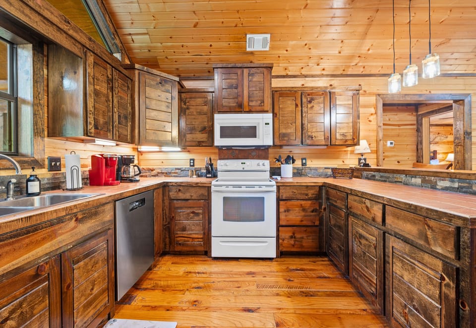 Cooking feels like a treat in this rustic kitchen, packed with all the essentials and a whole lot of cabin charm.