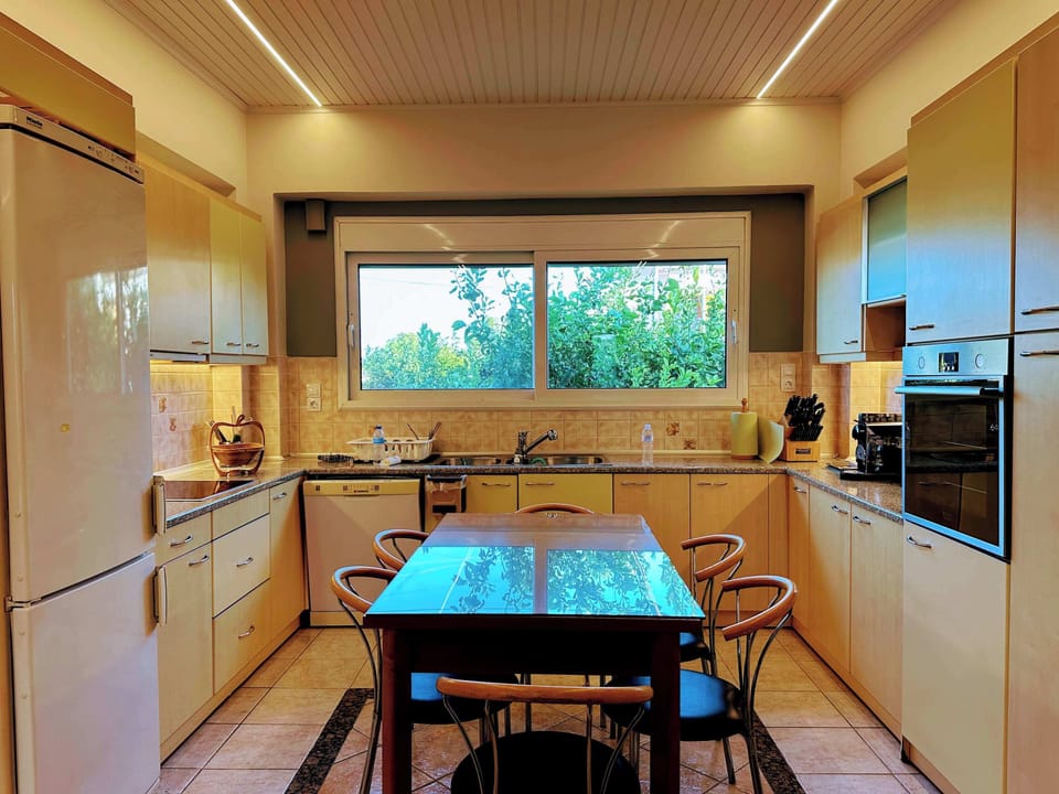 The fully equipped kitchen connects seamlessly with the living spaces, making meal preparation and social gatherings easy and enjoyable.