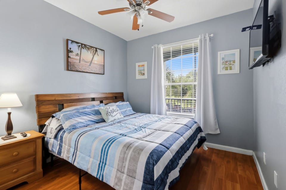 Comfortable queen bedroom with TV
