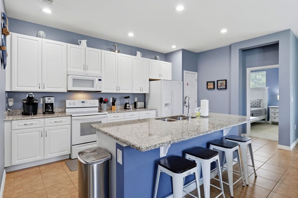 Cook, snack, and gather with ease in this bright and functional kitchen space.