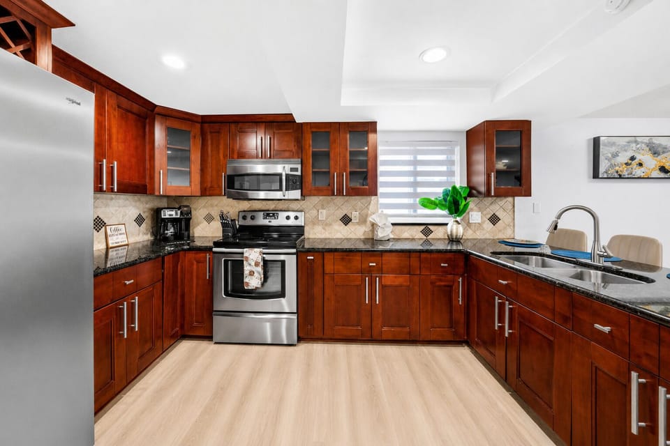 Fully equipped chef-friendly kitchen with abundant cabinetry, modern appliances, and everything needed for home-cooked meals.
