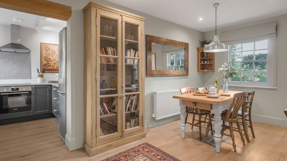 The farmhouse-chic kitchen and dining area overlooking the garden's delightful flowers.