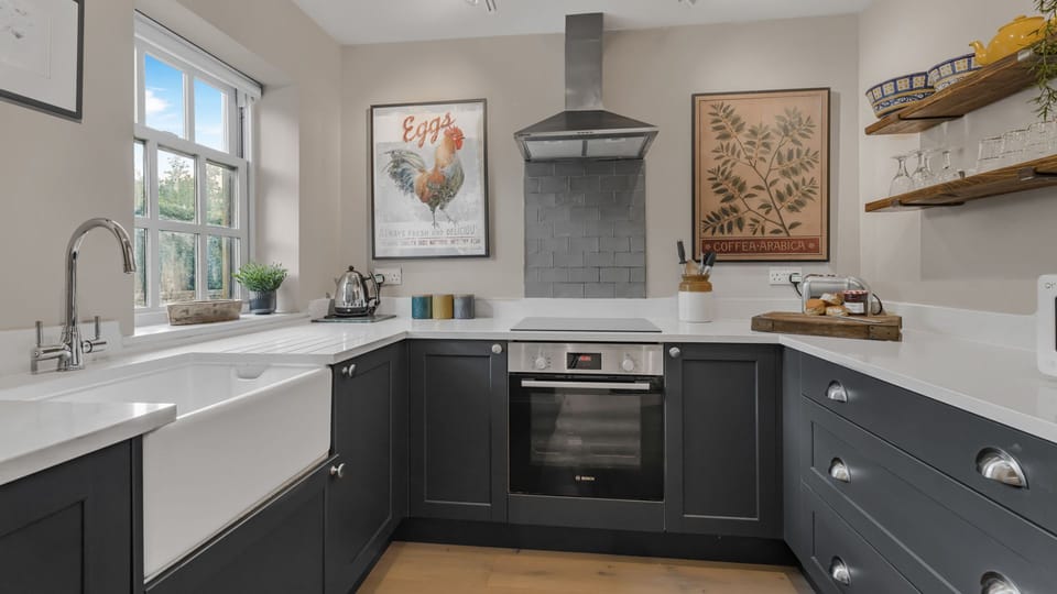 This kitchen is well-equipped and features a Nespresso Coffee Machine.