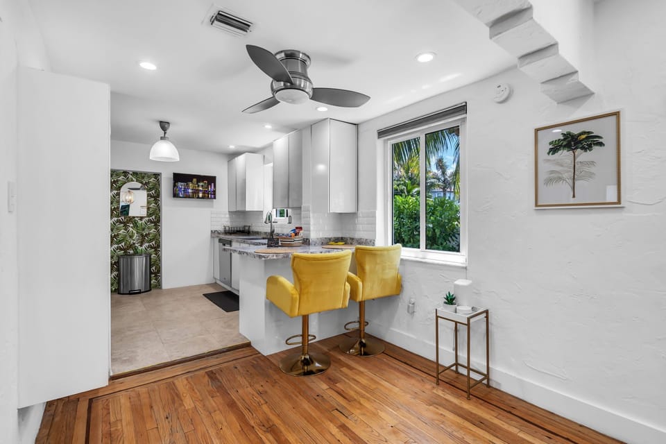 Enjoy casual bites or coffee at the kitchen seating by the window