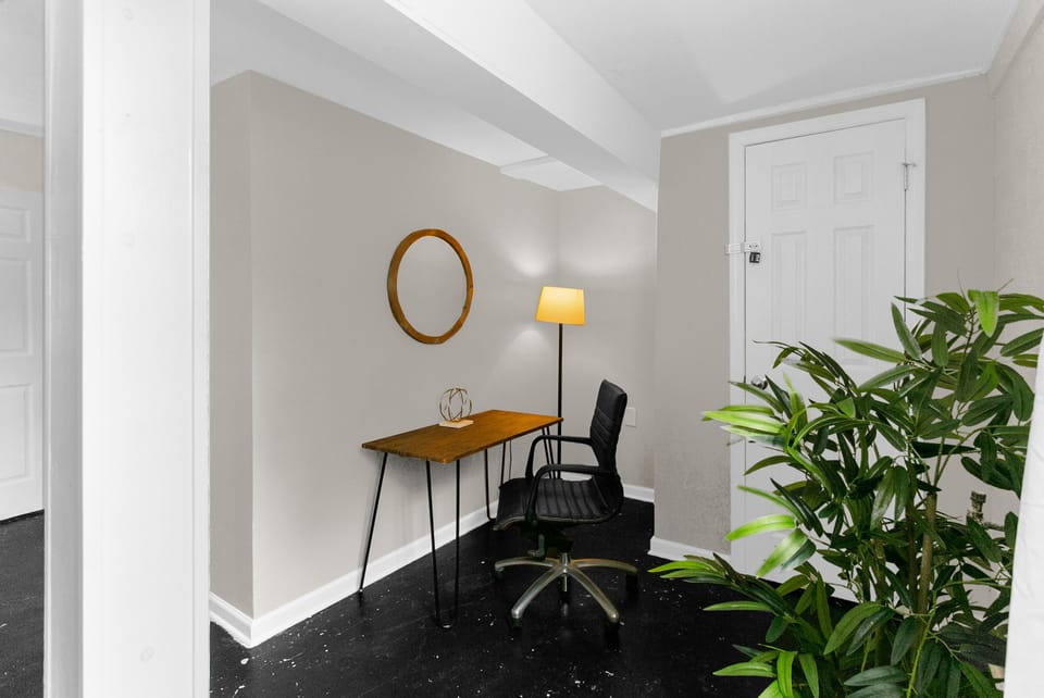 Stay productive at a dedicated workspace tucked within the twin bedroom, partially separated by a wall to create a quiet, focused area.