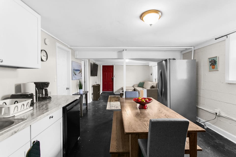 Enjoy a cozy dining space right in the heart of the kitchen, featuring a farmhouse table that makes every meal feel inviting.