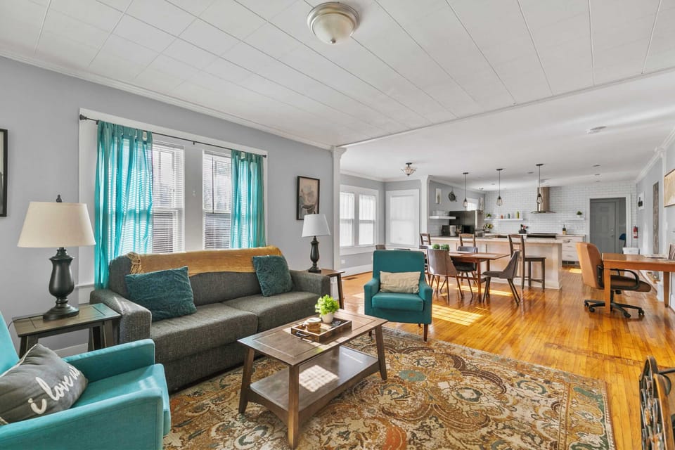 The main living area connects seamlessly to the front entry and the dining and kitchen areas, making coming and going feel easy and natural.