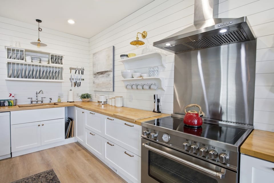 Fully Stocked Kitchen w/ Oven, Stove, Dishwasher, Refrigerator, Toaster, Coffee Maker, Cooking Utensils, Blender, and Dining Area