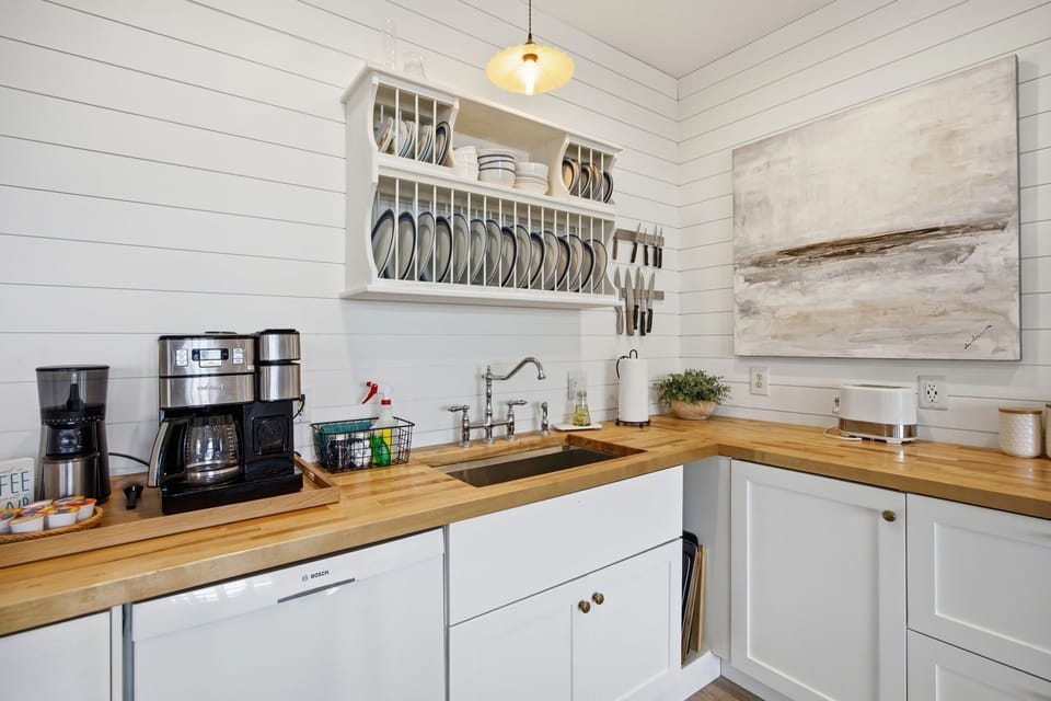 Fully Stocked Kitchen w/ Oven, Stove, Dishwasher, Refrigerator, Toaster, Coffee Maker, Cooking Utensils, Blender, and Dining Area