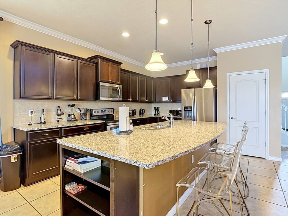 Spacious gourmet kitchen with granite island and bar seating
