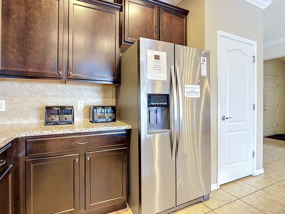 Well-appointed kitchen featuring premium appliances, generous storage, and stylish cabinetry.