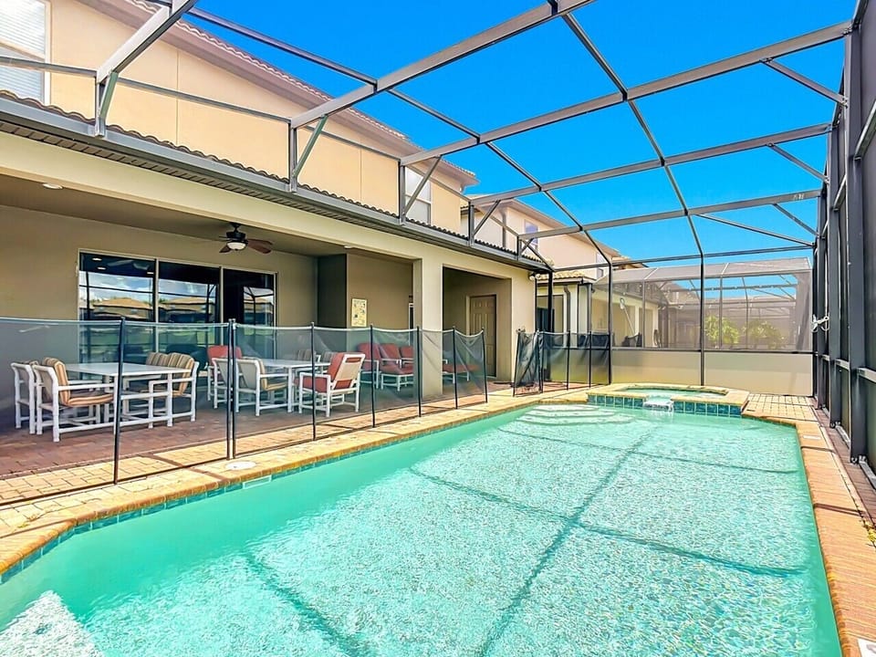 Screened-In Pool Deck with Safety Fence & Patio Seating