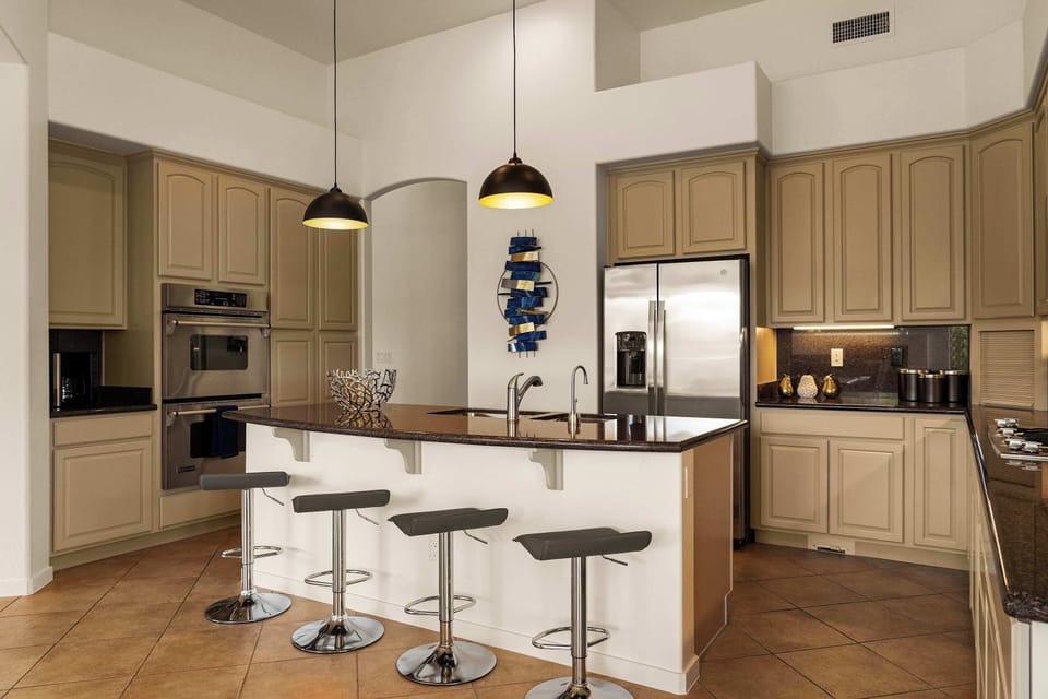 A large open kitchen with top to bottom storage and counter space
