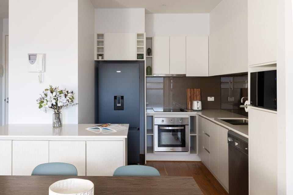 Whip up a delicious home-cooked meal in this fully equipped, modern kitchen, complete with ample counter space and sleek, full-sized appliances.