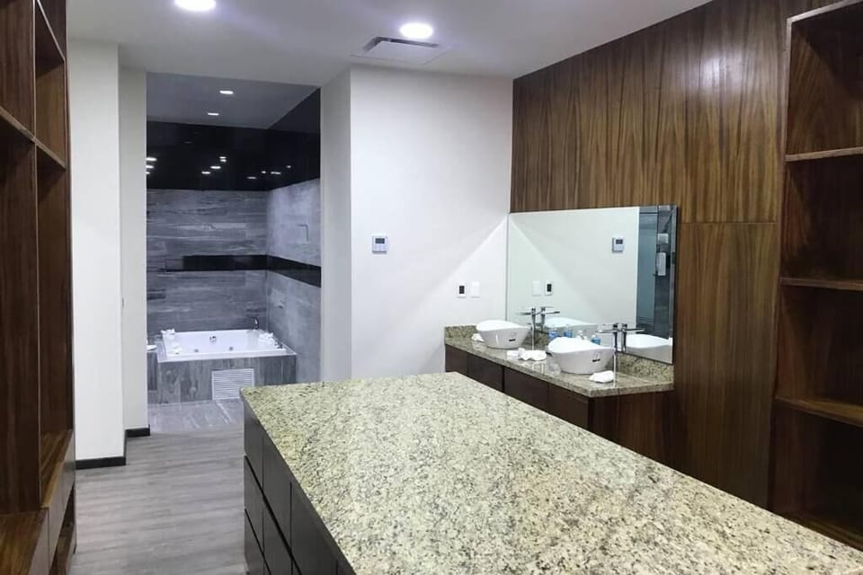 Luxury Penthouse | Bathroom | Shower, hair dryer, slippers, towels