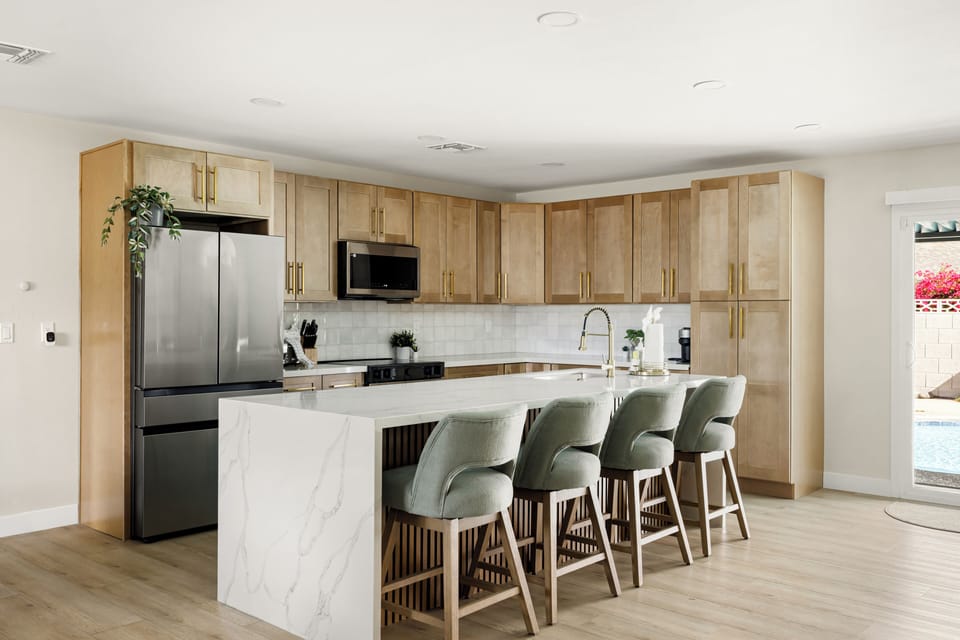 Modern open-concept kitchen with stylish finishes, bar seating, and plenty of space to gather.