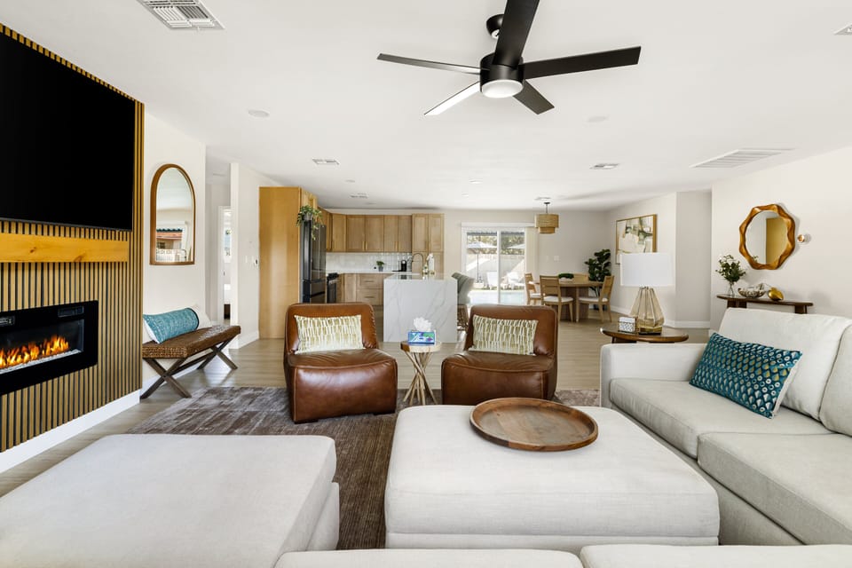 Open-concept living area designed for comfort, featuring ample seating and seamless flow into the kitchen.