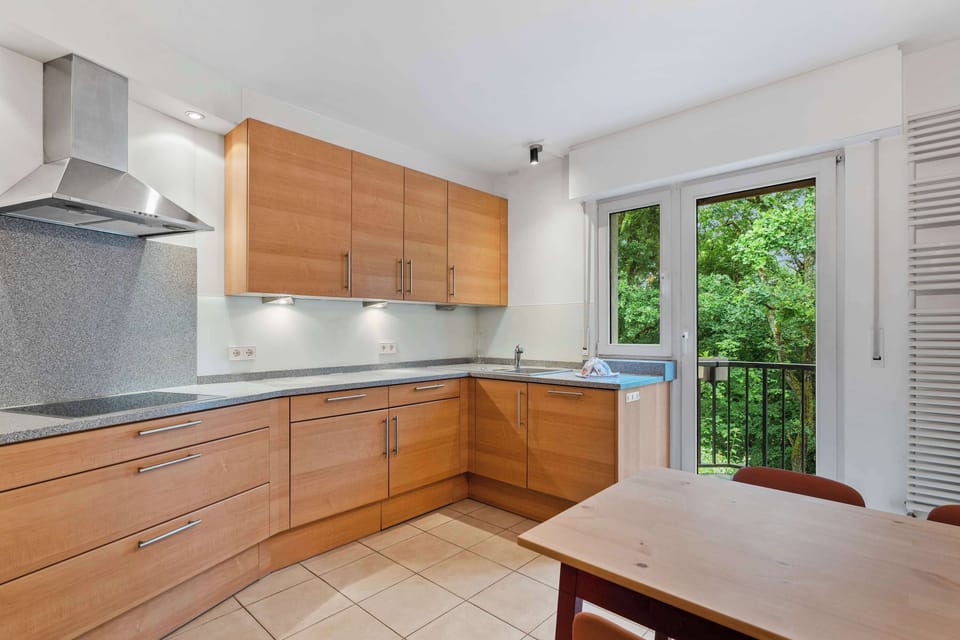 Fully equipped kitchen with wooden cabinetry, modern appliances, and everything needed for easy meals at home