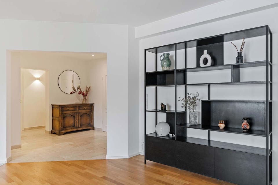 Elegant interior with modern shelving, warm décor, and a clean design that creates a welcoming atmosphere