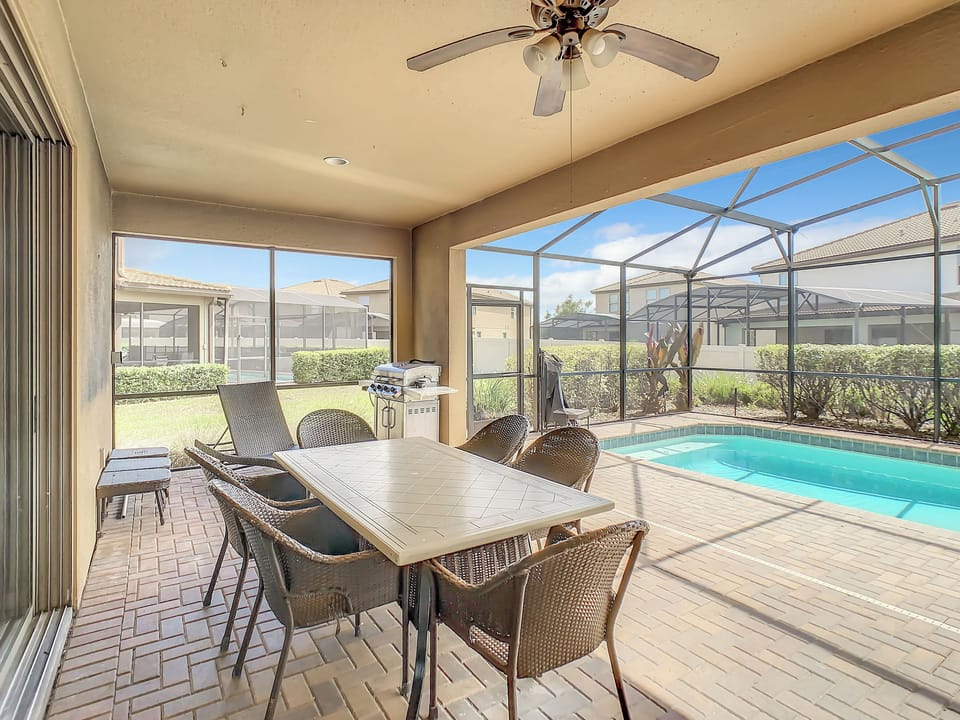 Patio table with chairs and BBQ grill
