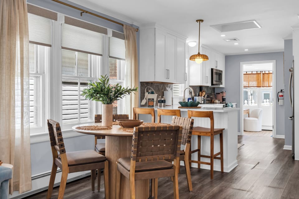 Bright modern kitchen with cozy dining nook and breakfast bar seating