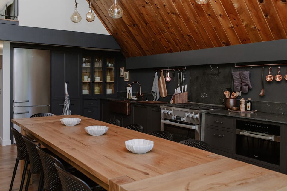 The massive wooden dining table seats up to ten. 