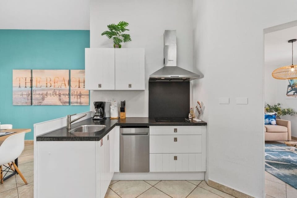 Fully equipped kitchen with modern appliances, cooking essentials, and everything needed to prepare meals at home.