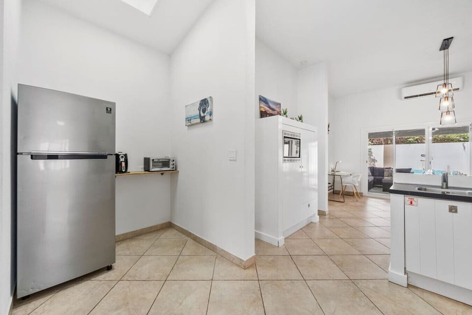 Bright kitchen featuring modern appliances, ample counter space, and an open layout ideal for everyday dining.