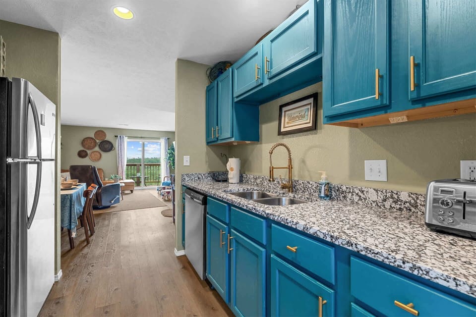 The cheerful kitchen offers ample space & all the comforts of home​