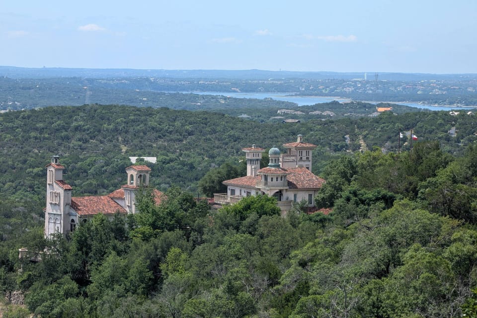 Beautiful views from the deck showing Villa Antonia, hills and Lake Travis