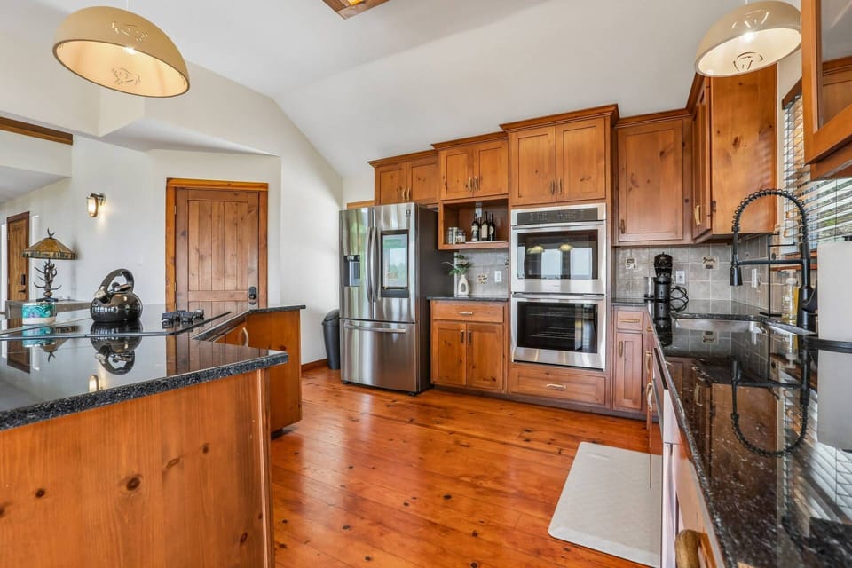Fully stocked kithen with refrigerator with ice maker, double oven, dishwasher and Keurig coffee maker