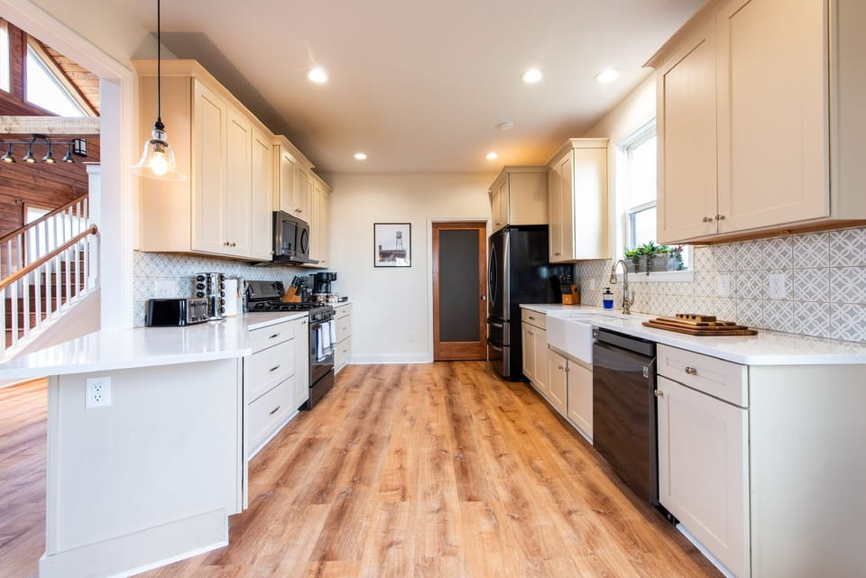 Chef's kitchen - gas range, farmhouse sink, and room to cook together