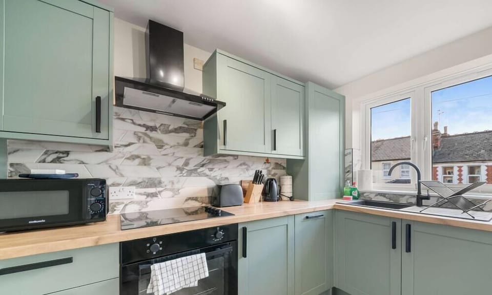 Fully equipped kitchen with modern appliances, cookware, and dining essentials. Perfect for preparing home-cooked meals, quick breakfasts, or enjoying a coffee before exploring the area.