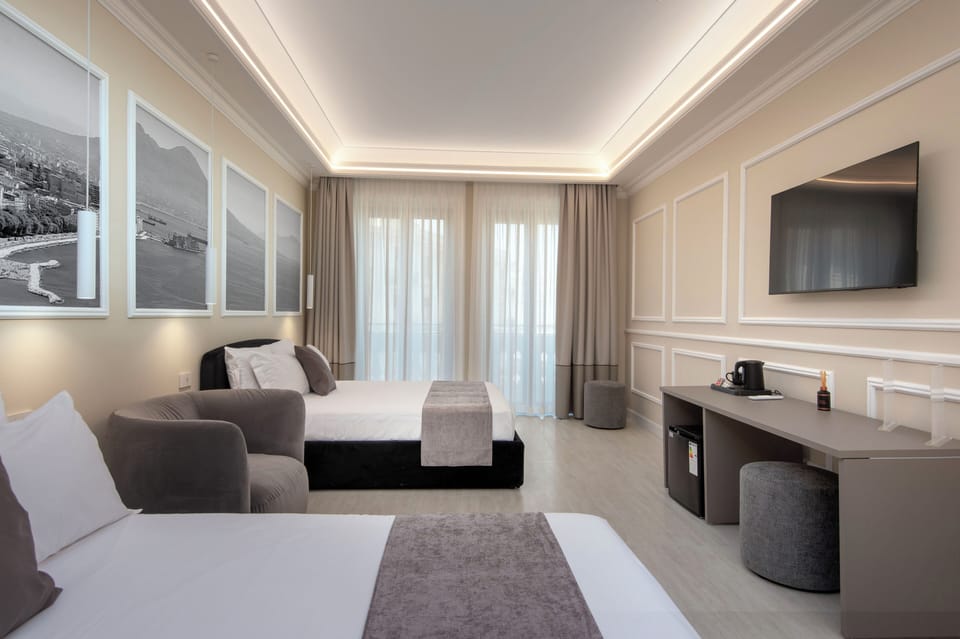 Luxury Quadruple Room, City View | Premium bedding, down comforters, pillowtop beds, minibar