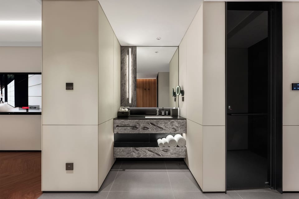 Shower, hair dryer, slippers, towels