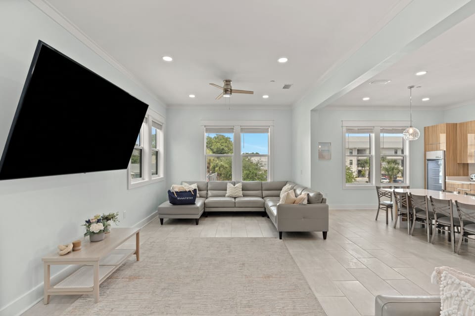 Bright second lounge with oversized sectional seating and plenty of space for movie nights.