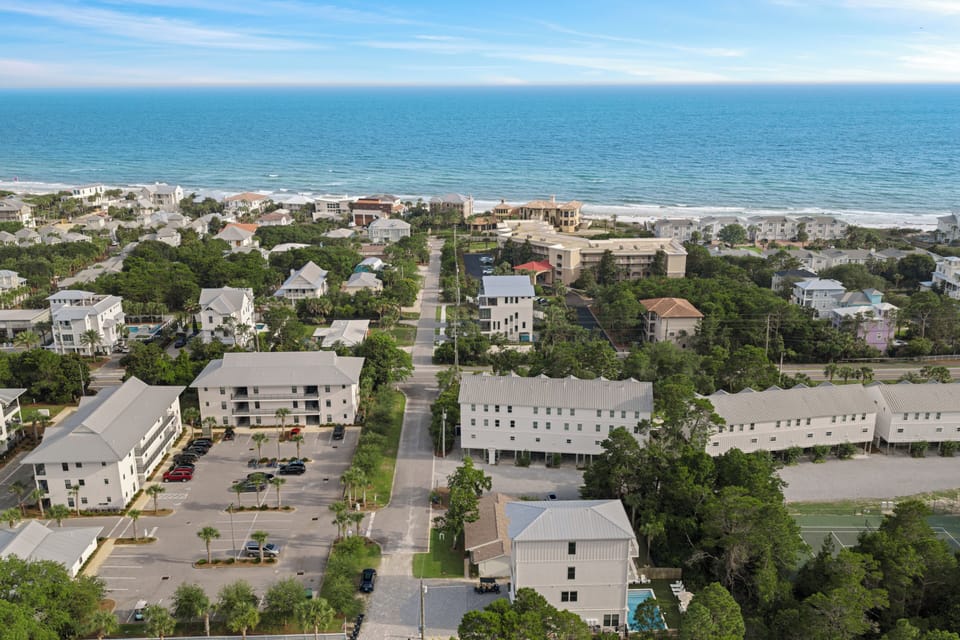 Aerial view showcasing the home’s close proximity to the beach and Gulf waters.