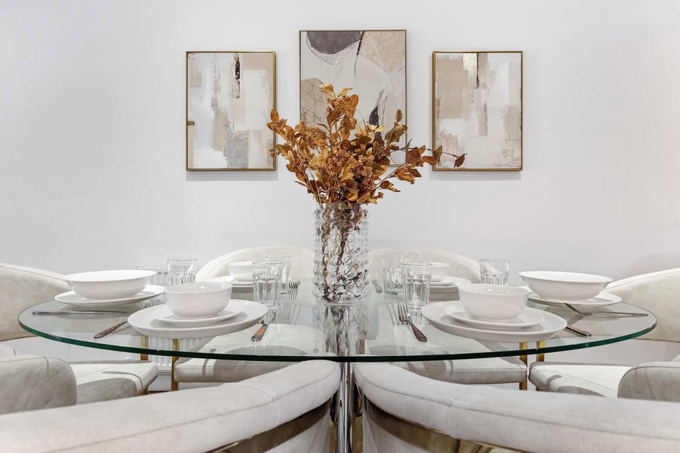 Dine elegantly at the glass table set for intimate gatherings.