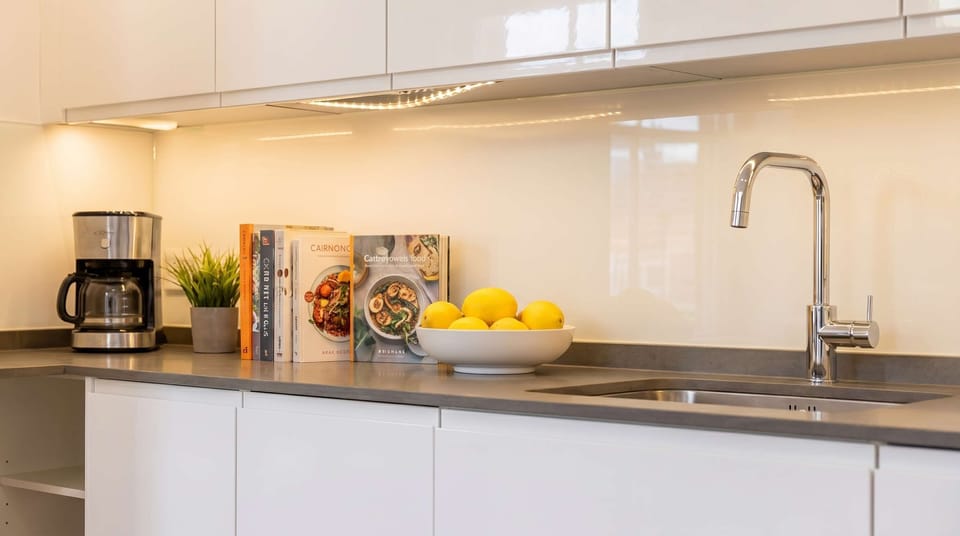 Prepare your morning coffee in a stylish, well-equipped kitchen.