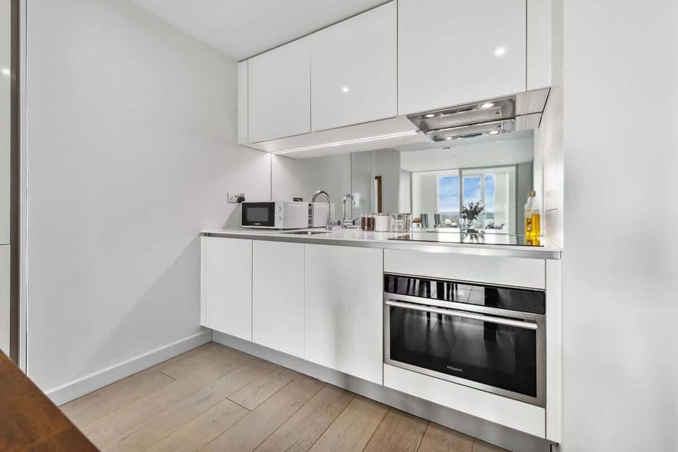 Enjoy the convenience of a stylish, fully equipped kitchenette—perfect for preparing quick bites or cozy dinners during your stay. | Photo tags: Kitchen