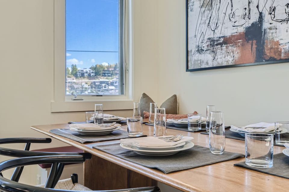 Gather around the dining table for shared meals, game nights, and easy conversation after a day exploring the mountains.