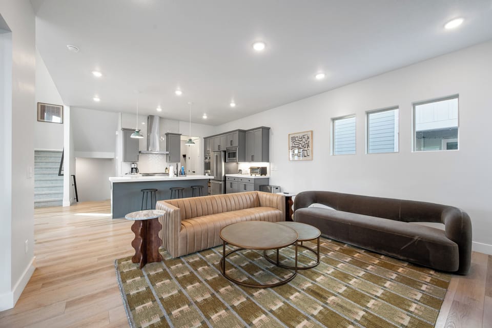 Spacious main level designed for entertaining, featuring a sophisticated neutral palette and hardwood floors.