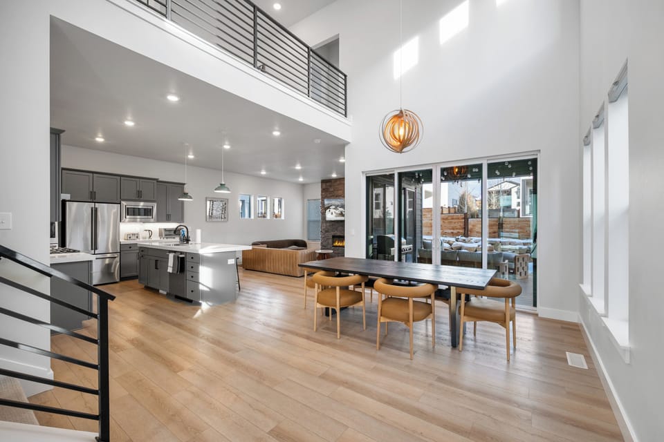 Architectural view from the dining room looking toward the kitchen and upper mezzanine.
