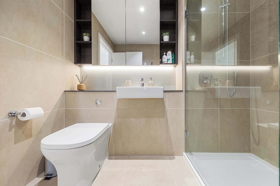 Get ready comfortably with convenient bathroom amenities and mirror cabinet to keep your essentials organized.